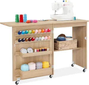 Best Choice Products Folding Sewing Table Multipurpose Craft Station & Side Desk with Compact Design, Wheels, Shelves, Storage Trays, Pegs, Magnetic Doors, Metal Doorknobs - Light Brown