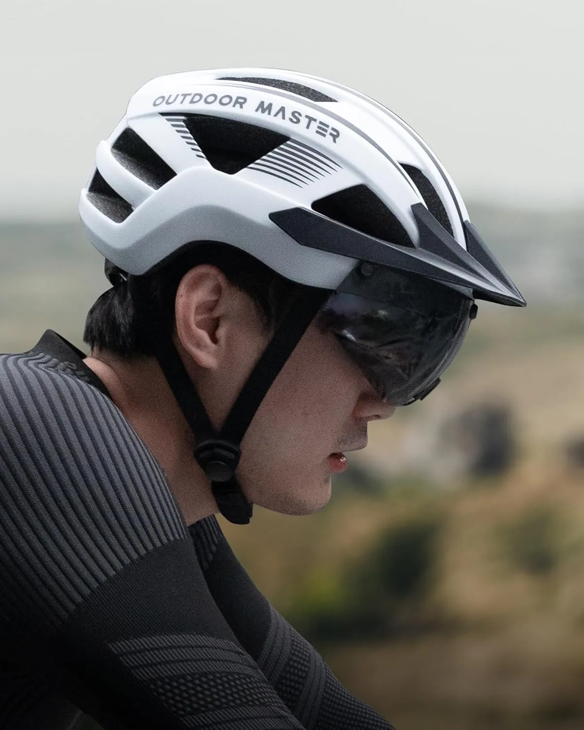 OutdoorMaster Adult Bike Helmet - Bicycle Helmet with Rechargeable Rear LED Light, Detachable Magnetic Goggles, Removable Sun Visor - Suitable for Commuting and Cycling for Men and Women